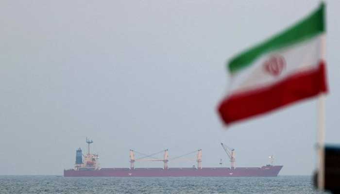 A picture taken on April 29, 2023, shows a shipping vessel sailing past Irans Gulf island of Qeshm. — AFP