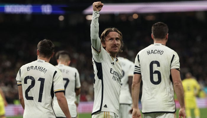 Real Madrid´s Croatian midfielder Luka Modric celebrates scoring his teams fourth goal during the Spanish league football match between Real Madrid CF and Villarreal CF at the Santiago Bernabeu stadium in Madrid on December 17, 2023. — AFP