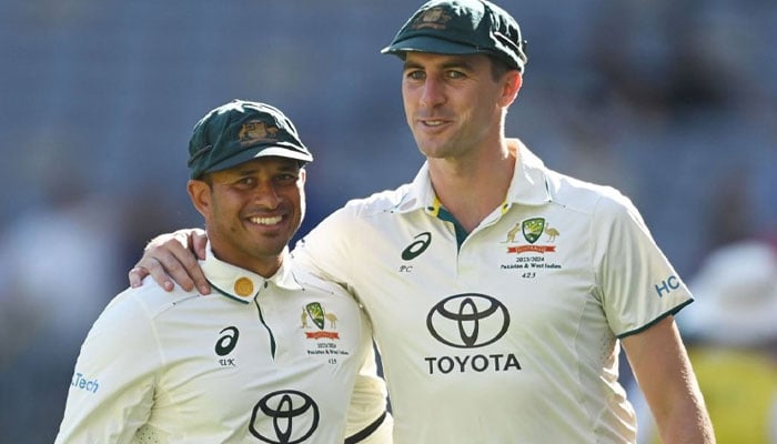 Australian batter Usman Khawaja with his skipper Pat Cummins. — AFP/File