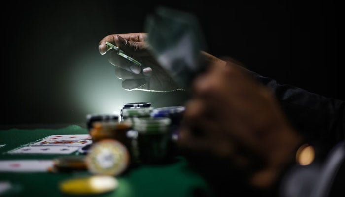 Representational image of cards and poker chips. — Unsplash