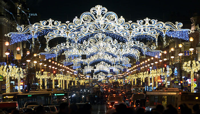 A busy street decorated with Christmas lights. — AFP/File