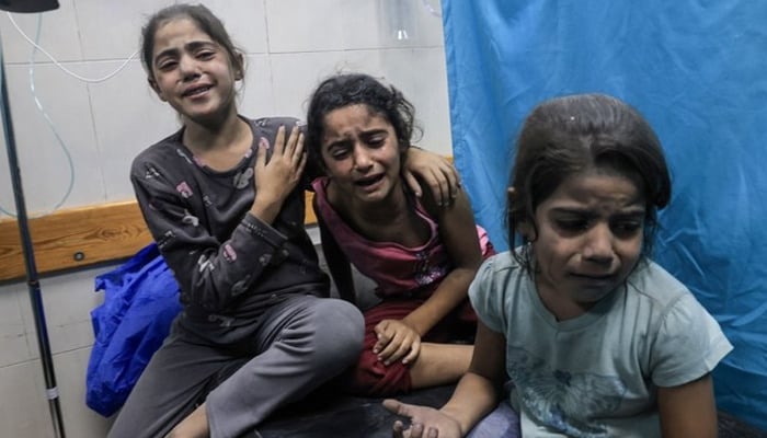 Palestinian children at a hospital after Israeli strikes injure several, in this undated image. — AFP