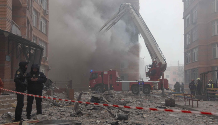 Firefighters extinguish a fire in a high-rise building after a missile attack in Odesa on December 29, 2023, amid the Russian invasion of Ukraine. — AFP