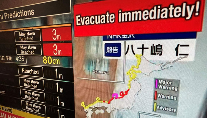 This image taken in Hong Kong on January 1, 2024, shows a warning message on a screen from a live feed on NHK World asking people to evacuate from the area after a series of major earthquakes hit central Japan. — AFP