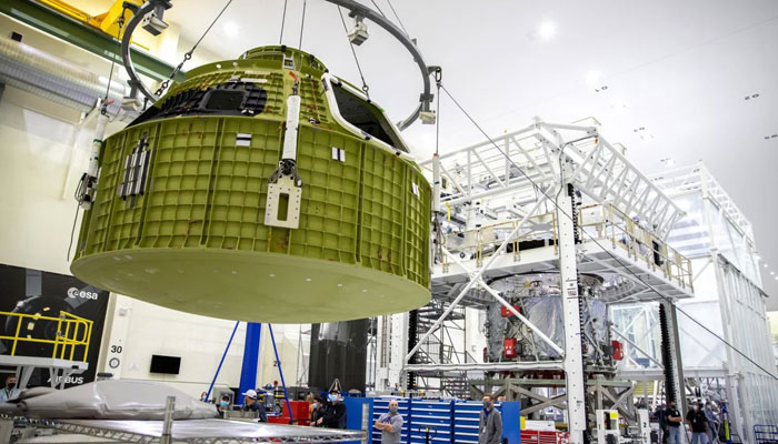 The Orion pressure vessel for Nasa’s Artemis III mission is shown being lifted by crane for its move onto a work stand at Nasa’s Kennedy Space Center in Florida in 2021. — Nasa/File