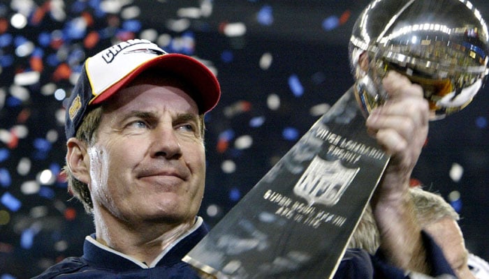 Bill Belichick holds up the Vince Lombardi Trophy after coaching the New England Patriots to a Super Bowl win in 2004. — AFP/File