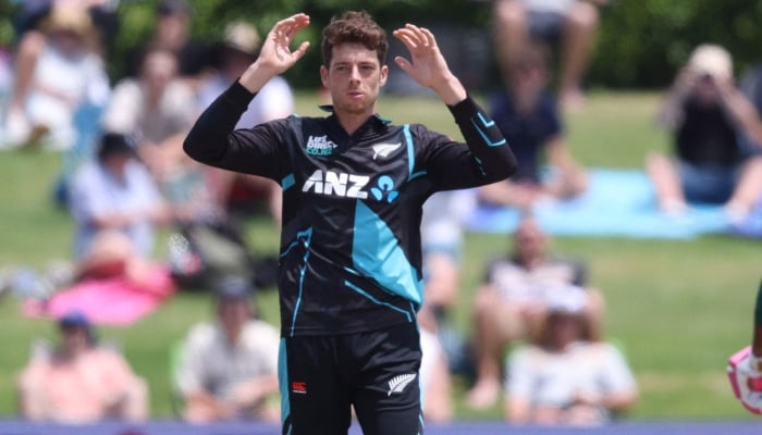 New Zealand´s Mitchell Santner during the third Twenty20 cricket match between New Zealand and Bangladesh at Bay Oval in Mount Maunganui on December 31, 2023. —AFP