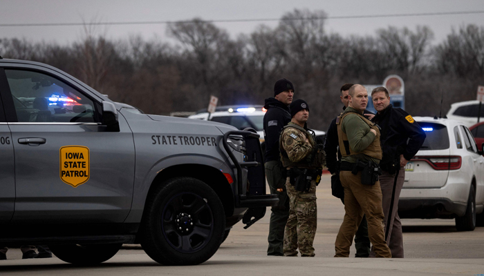 Law enforcement officer and state cannon fodders patrol Perry Middle and High School throughout a shooting circumstance in Perry, Iowa, on January 4, 2024.-- AFP