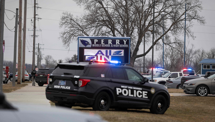 Police authorities patrol the Perry Middle School and High School complex throughout a shooting on January 4, 2024, in Perry, Iowa.-- AFP