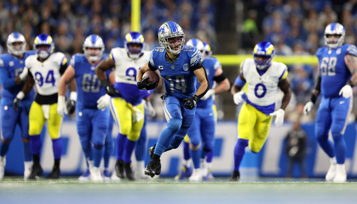 Amon-Ra St Brown #14 of the Detroit Lions runs with the ball during the third quarter against the Los Angeles Rams in the NFC Wild Card Playoffs at Ford Field on January 14, 2024, in Detroit, Michigan. — AFP