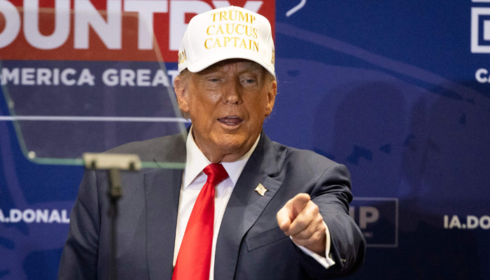 Former US President and 2024 Republican presidential hopeful Donald Trump departs to a Caucus event at Simpson College in Indianola, Iowa, on January 14, 2024. — AFP