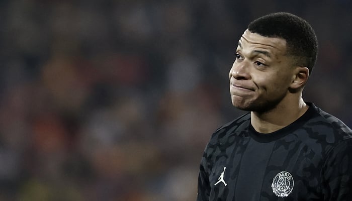 Paris Saint-Germains Kylian Mbappe reacts during the French L1 football match between RC Lens and Paris Saint-Germain (PSG) at Stade Bollaert-Delelis in Lens, northern France on January 14, 2024. — AFP