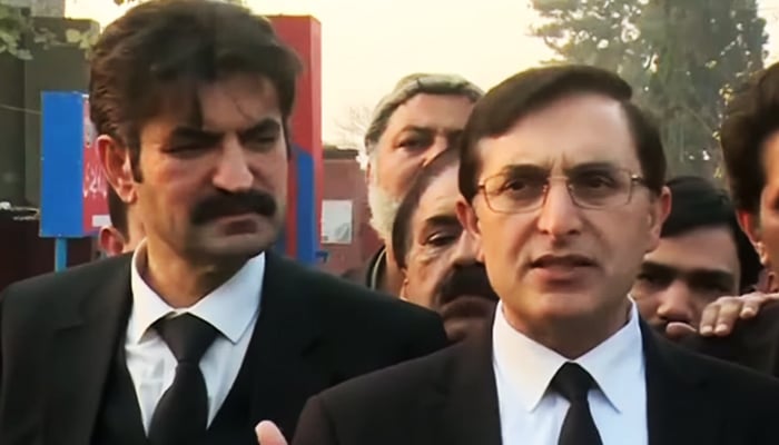 Senior PTI leader Barrister Gohar Ali Khan (right) addressing a press conference in Rawalpindi, on January 18, 2023, in this still taken from a video. — Geo News