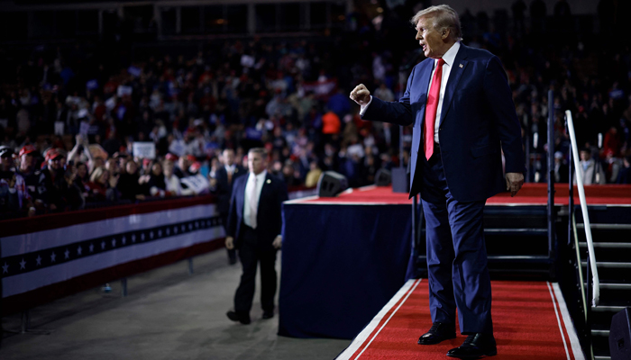 Republican presidential candidate and former President Donald Trump acknowledges supporters as he leaves the stage at the SNHU Arena on January 20, 2024 in Manchester, New Hampshire. — AFP