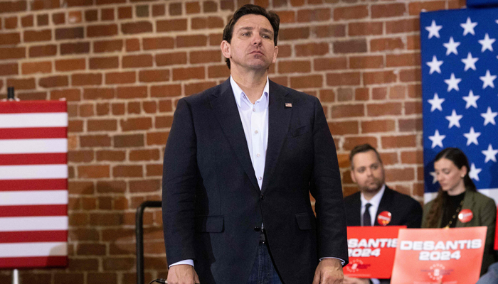 Florida Governor Ron DeSantis listens to an audience members question at a campaign event in Davenport, Iowa, on January 13, 2024. — AFP