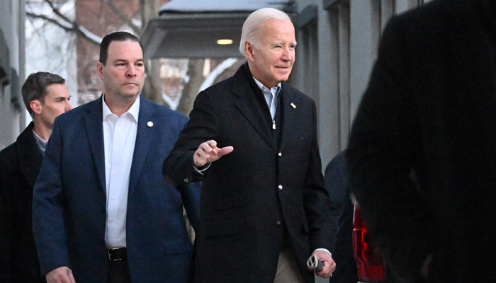 US President Joe Biden steps out of Saint Edmond Roman Catholic Church after attending mass in Rehoboth Beach, Delaware, on January 20, 2024.  AFP