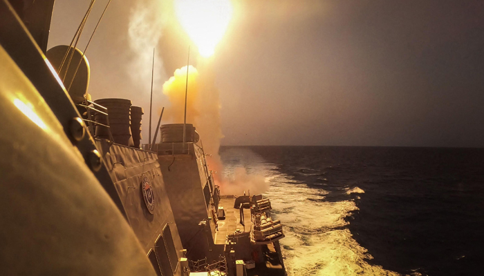 This picture taken on October 19, 2023 shows the Arleigh Burke-class guided-missile destroyer USS Carney (DDG 64) defeating a combination of Houthi missiles and unmanned aerial vehicles in the Red Sea. — AFP