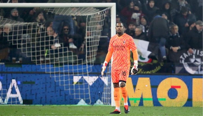 Milans goalkeeper Mike Maignan reacts during the Italian Serie A football match Udinese Calcio vs AC Milan at the Friuli - Dacia Arena stadium in Udine, on January 20, 2024. — AFP