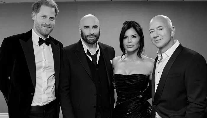 Prince Harry poses with Lauren Sánchez, John Travolta and Jeff Bezos