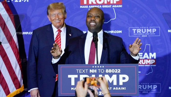 US Republican Senator from South Carolina Tim Scott speaks as former President Donald Trump listens during a campaign event in Concord, New Hampshire, on January 19, 2024. — AFP
