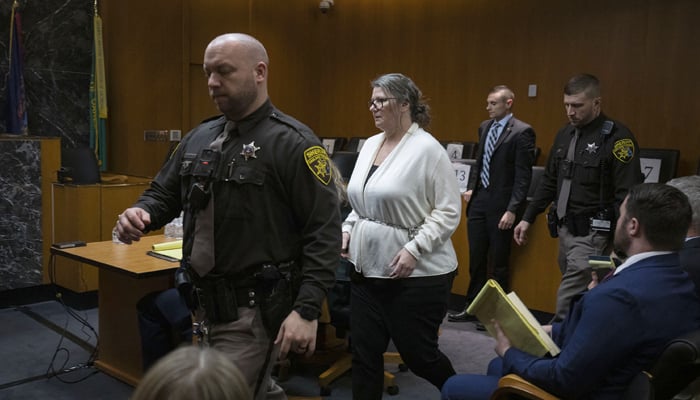 Jennifer Crumbley, the mother of Oxford school shooter Ethan Crumbley, re-enters the courtroom in Oakland County Circuit Court after she was called back into the courtroom when the jury had a question during their deliberations on four counts of involuntary manslaughter on February 5, 2024, in Pontiac, Michigan. — AFP