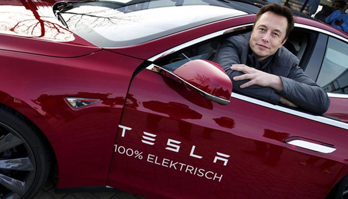 Elon Musk in a Tesla car. — AFP/File