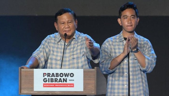 Indonesian presidential candidate Prabowo Subianto (L) addresses supporters after polls closed in the countrys presidential and legislative elections in Jakarta on February 14, 2024. — AFP