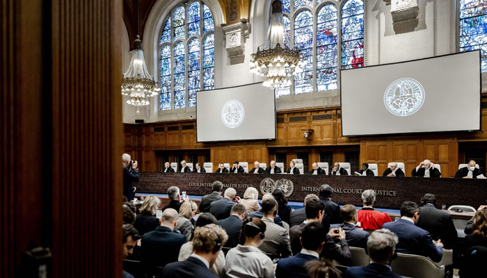 Judges led by the International Court of Justice (ICJ) President Joan Donoghue (C) participate in a hearing at the ICJ before a judgment in The Hague, on January 31, 2024.-- AFP