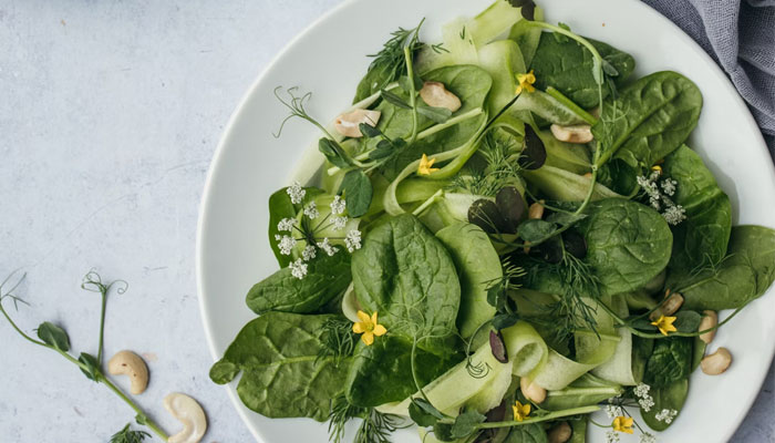 A plate of leafy greens. — Unsplash