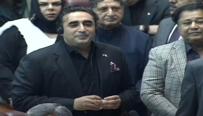 PPP Chairman Bilawal Bhutto Zardari surrounded by his party lawmakers after the SIC MNAs started their protest during his speech. — Screengrab/PTV Parliament