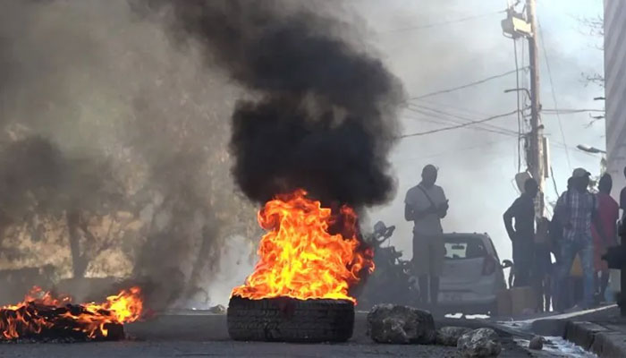The image shows a tire on fire. — AFP/File
