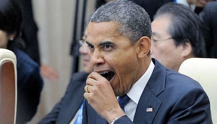 Former US president Barack Obama yawning. — AFP/File