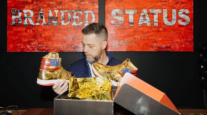 Donald Trump sneakers: Roman Sharf: The Russian CEO who won autographed  pair of Trump's golden sneakers - The Economic Times