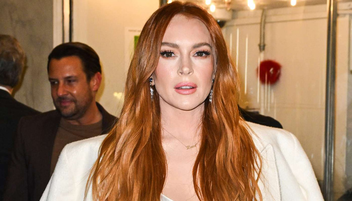 Lindsay Lohan donned a white silky dress resembling a bridal gown at the Irish Wish premiere