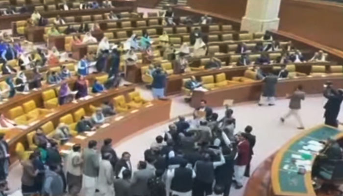 PTI-backed SIC lawmakers gather before the speakers dice inside the Punjab Assembly, in this still taken from a video. — YouTube/Geo News Live