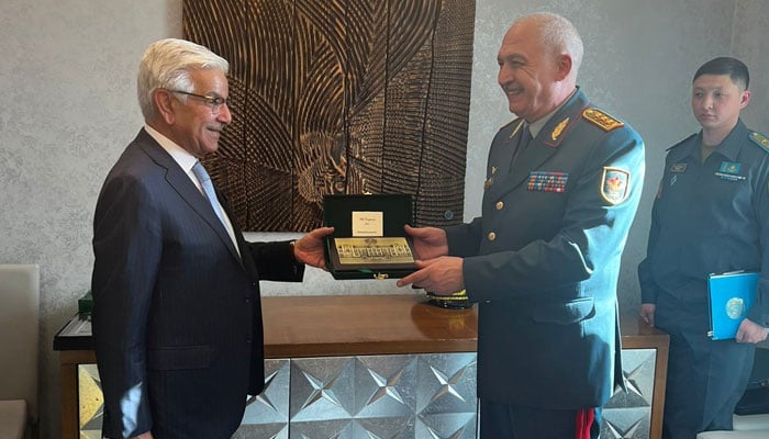 Defence Minister Khawaja Asif (left) meets Kazakhstan counterpart Zhaksylykov Ruslan Fatihovich on SCO sidelines in Kazakhstan