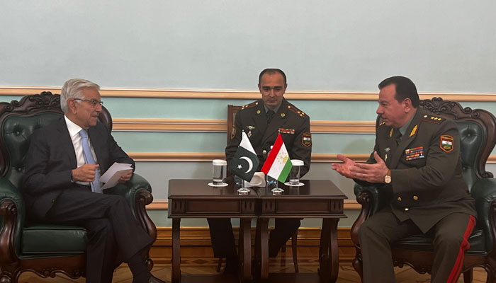 Defence Minister Khawaja Asif (left) speaking to Tajikistans Defence Minister Sherali Mirzo on SCO sidelines