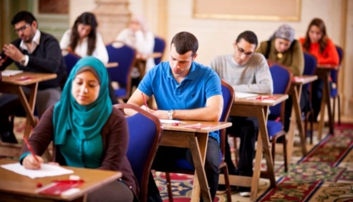A representational image shows people taking exam at a British Council centre. —britishcouncil.pk/ File