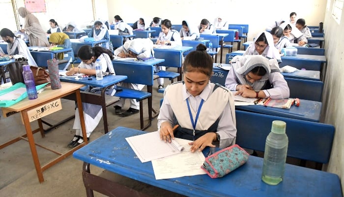 Students are solving their papers in a class room during 9th grade annual examination at a local school in Karachi on May 7, 2024. —Online