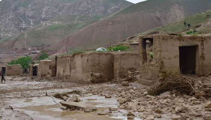 This photo shows damaged houses along a mud-covered road following a flash flood after a heavy rainfall, in Sheikh Jalal village of Baghlan-e-Markazi district in Baghlan province on May 11, 2024. — AFP