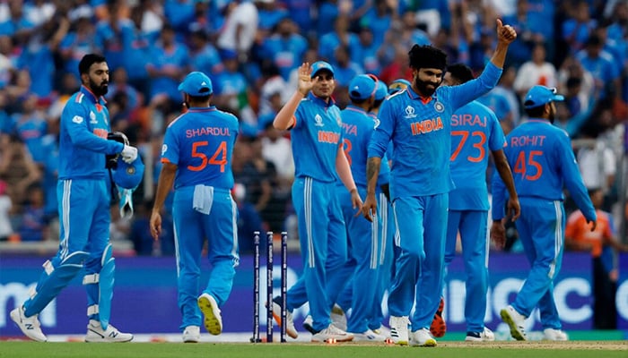 Indian players celebrate together after taking a wicket during the match against Pakistan in Ahmedabad, India, October 14, 2023. — Reuters