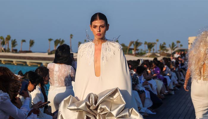 Models present creations of Saudi designer Tima Abid during a show at the Red Sea Fashion Week in Saudi Arabia´s Ummahat Island on May 16, 2024. — AFP/File