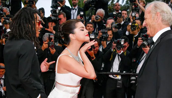 Selena Gomezs red carpet glamour sets hearts aglow.