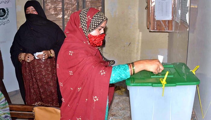 A woman casts her vote at a polling station during by-election in NA-148, Multan, May 19, 2024. — APP