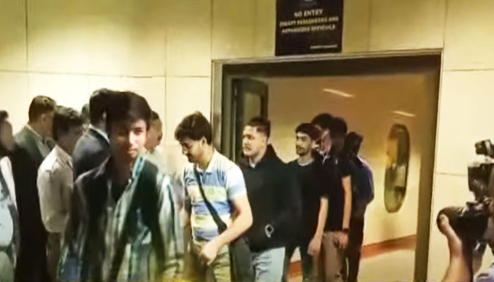 Students returning from Bishkek are receieved by Pakistani authorities at Islamabad airport in this still taken from a video. — Geo News/YouTube