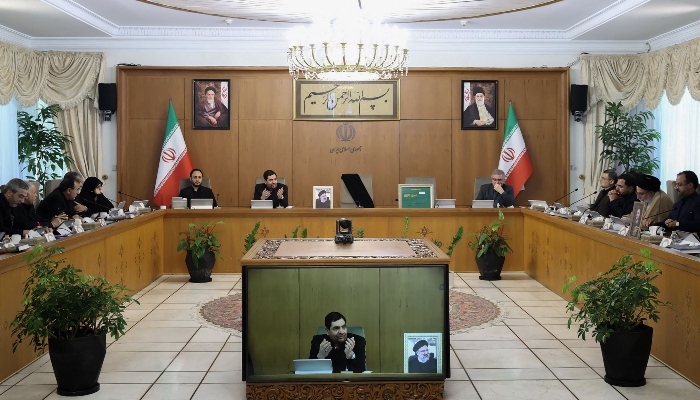 A handout picture released by the Iranian presidency shows Iran’s Interim President Mohammad Mokhber (screen front), with the seat of the late president Ebrahim Raisi (portrait) next to him empty (back), during a cabinet meeting in Tehran on May 20, 2024. —Reuters