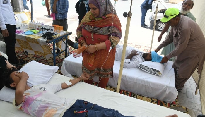 People, affected by the heatwave, receive medical treatment at a Heatstroke Treatment Camp in Karachi on May 22, 2024. — Online