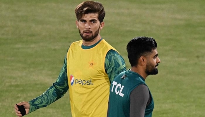 Pakistan left-arm quick Shaheen Shah Afridi (left) and captain Babar Azam warm up during the practice session in this undated photo. — AFP/File