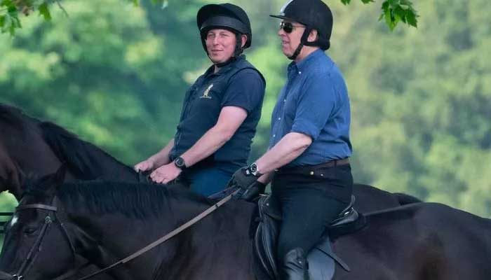 Prince Andrew looks happy while riding horse on the Windsor estate