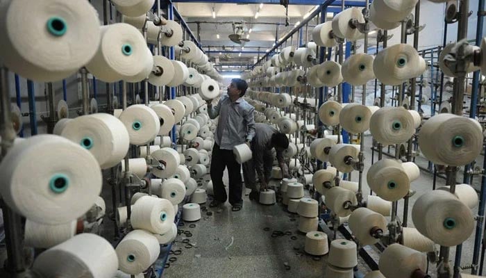 A representational image of a man working in a textile factory. — AFP/File